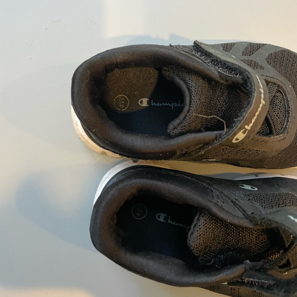 Champion sneakers size baby/toddler 4. Used and a little dirty.